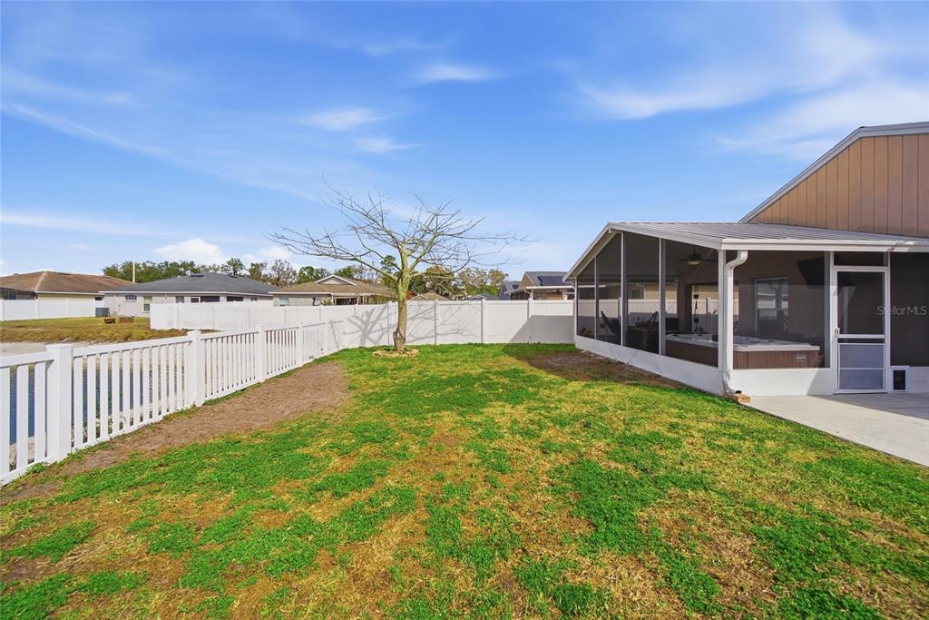 4066 Sundance Pl Loop Mulberry, FL 33860 - Photo 25 of 28 a view of a backyard with sitting area