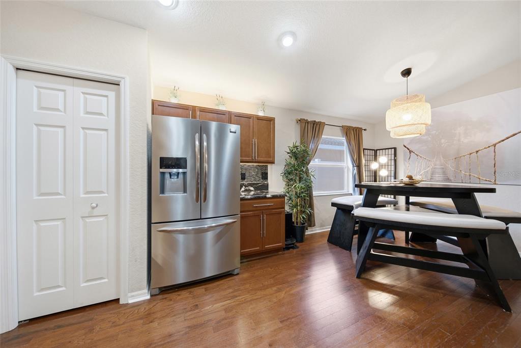 4066 Sundance Pl Loop Mulberry, FL 33860 - Photo 7 of 28 a kitchen with a refrigerator a sink and cabinets