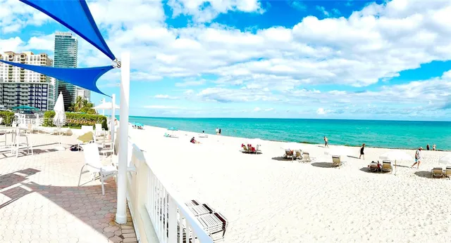 a view of a swimming pool with a lounge chair
