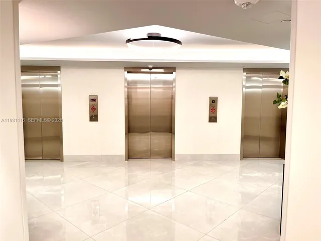 a bathroom with a sink shower and a mirror