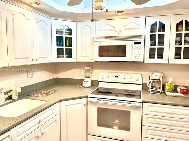 a kitchen with a stove and a sink