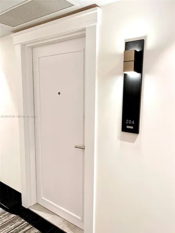 a kitchen with stainless steel appliances a stove a sink and a refrigerator