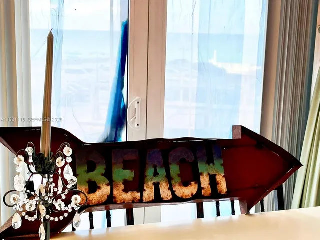 a view of a balcony with a black and white door