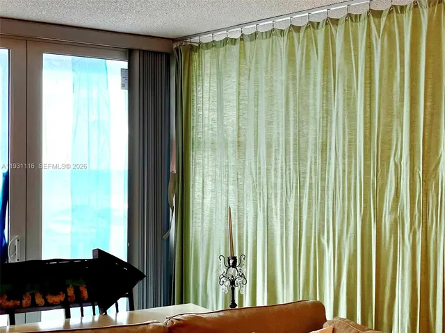 a bathroom with a granite countertop toilet sink and shower