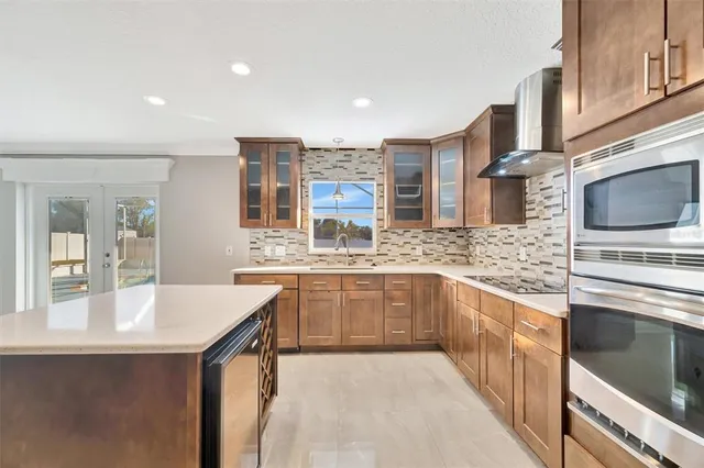 an empty room with a ceiling fan and a window