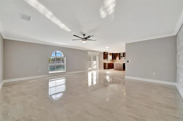 a view of a couches and dinning table and chairs in the patio