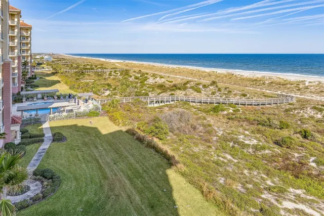 a view of a living room and kitchen with a large window