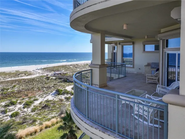 a bedroom with a bed and ceiling fan