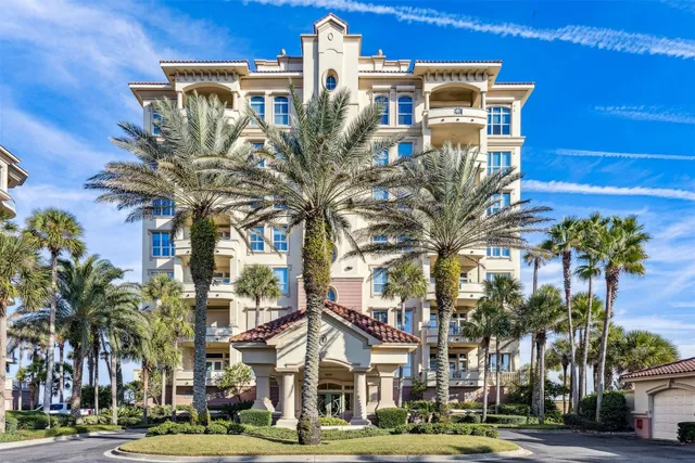 a view of a palm trees in front of a building