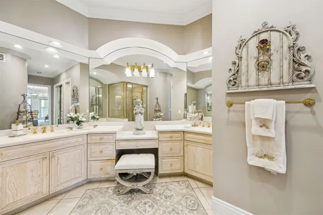 a bedroom with a bed chair and a large window