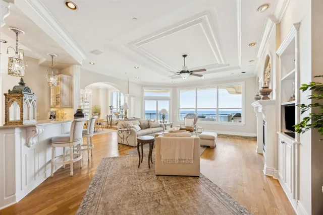 a living room with fireplace furniture and a wooden floor