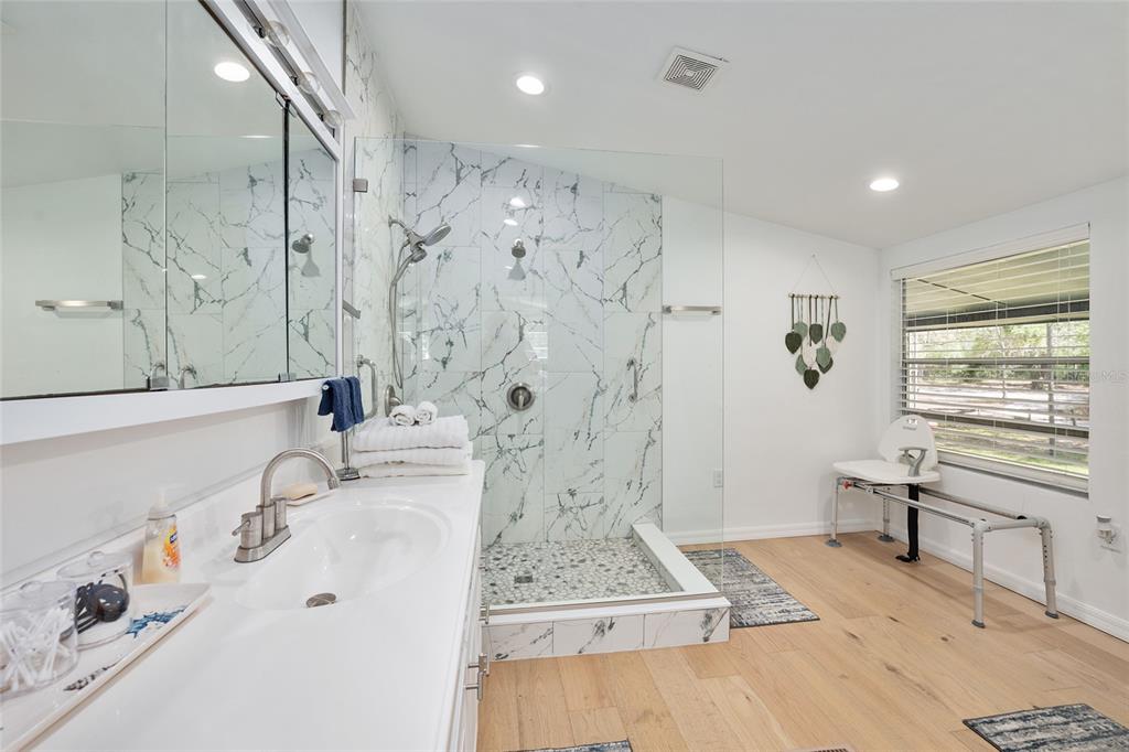 7870 Southwest 25th Place Bell, FL 32619 - Photo 86 of 99 a bathroom with a bathtub sink and a shower