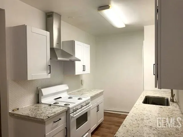 a kitchen with a stove and a sink
