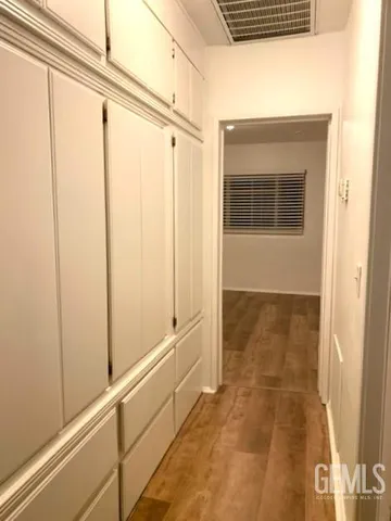 a bathroom with a shower and a door