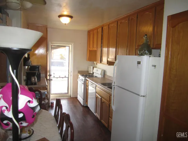 a kitchen with stainless steel appliances a refrigerator and a stove
