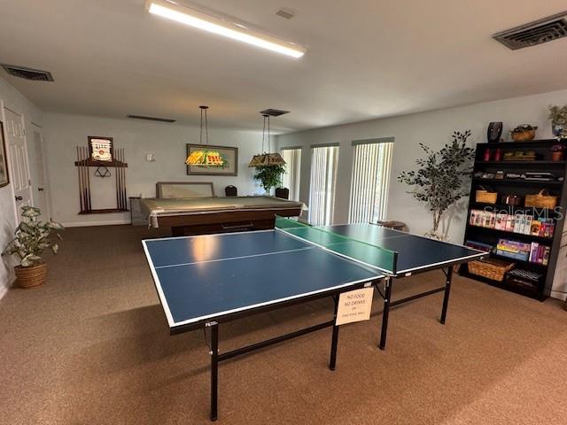11485 Oakhurst Road, Unit 319 Largo, FL 33774 - Photo 51 of 63 a room with pool table and windows