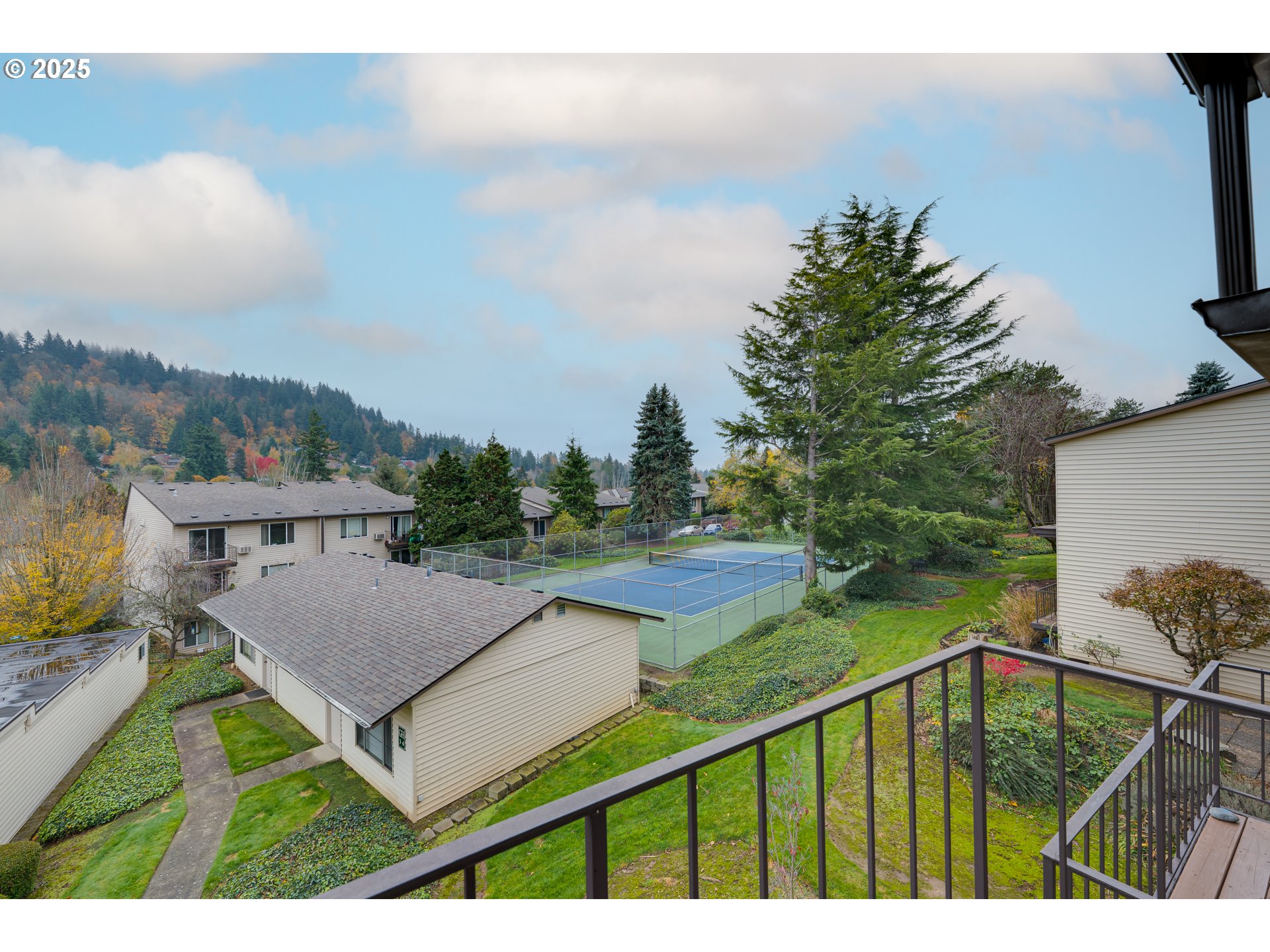 200 Southwest Florence Avenue, Unit D12 Gresham, OR 97080 - Photo 12 of 24 a view of a terrace with a garden and trees
