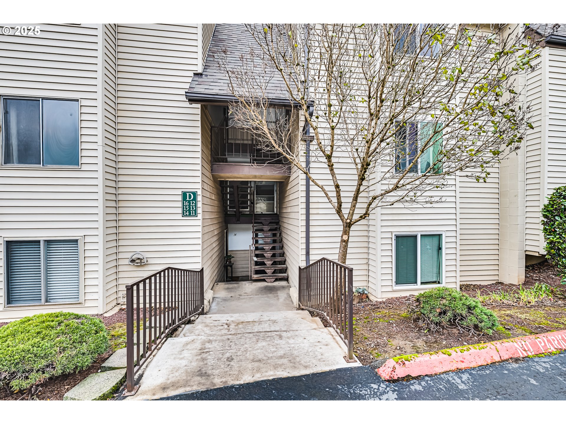 200 Southwest Florence Avenue, Unit D12 Gresham, OR 97080 - Photo 15 of 24 a view of a house with a yard and porch