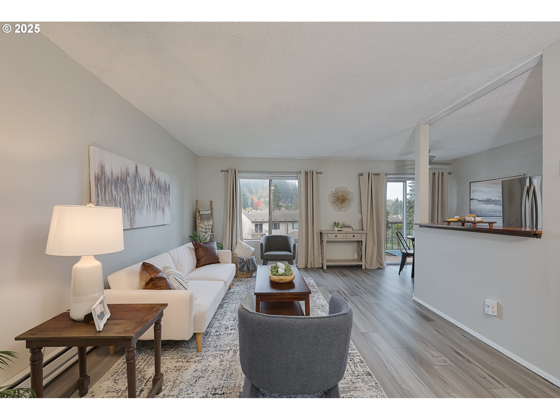 200 Southwest Florence Avenue, Unit D12 Gresham, OR 97080 - Photo 2 of 24 a living room with furniture and a wooden floor