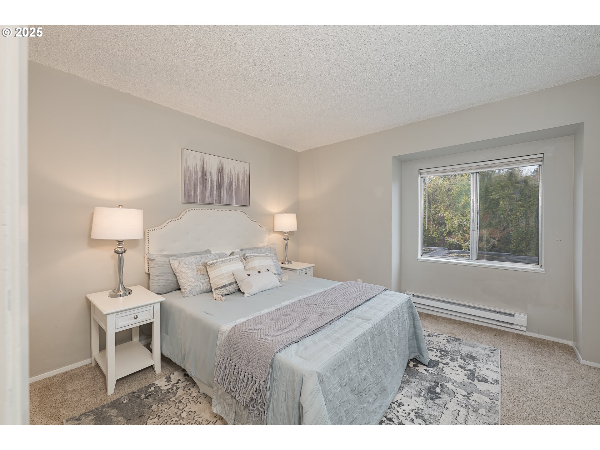 200 Southwest Florence Avenue, Unit D12 Gresham, OR 97080 - Photo 10 of 24 a bedroom with a bed and a window