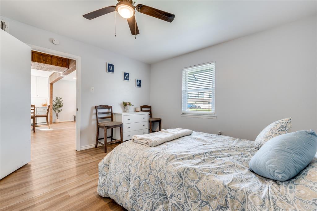 2924 West 11th Street Irving, TX 75060 - Photo 13 of 39 a bedroom with a bed closet and a window