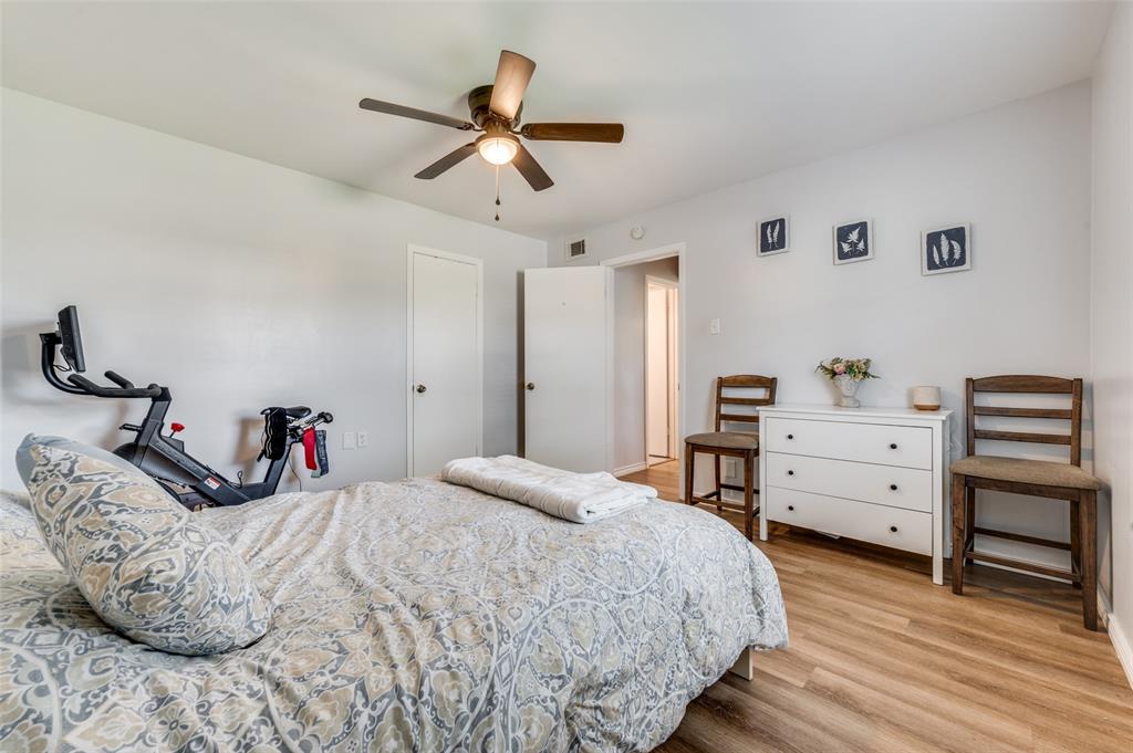 2924 West 11th Street Irving, TX 75060 - Photo 14 of 39 a bedroom with a bed and a dresser