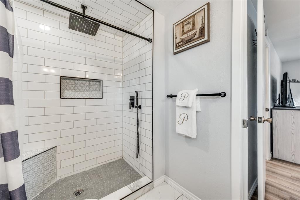 2924 West 11th Street Irving, TX 75060 - Photo 20 of 39 a bathroom with a shower