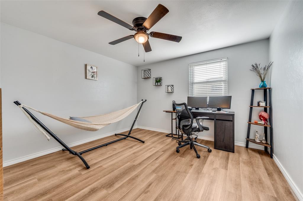 2924 West 11th Street Irving, TX 75060 - Photo 25 of 39 a workspace with wooden floor and a window