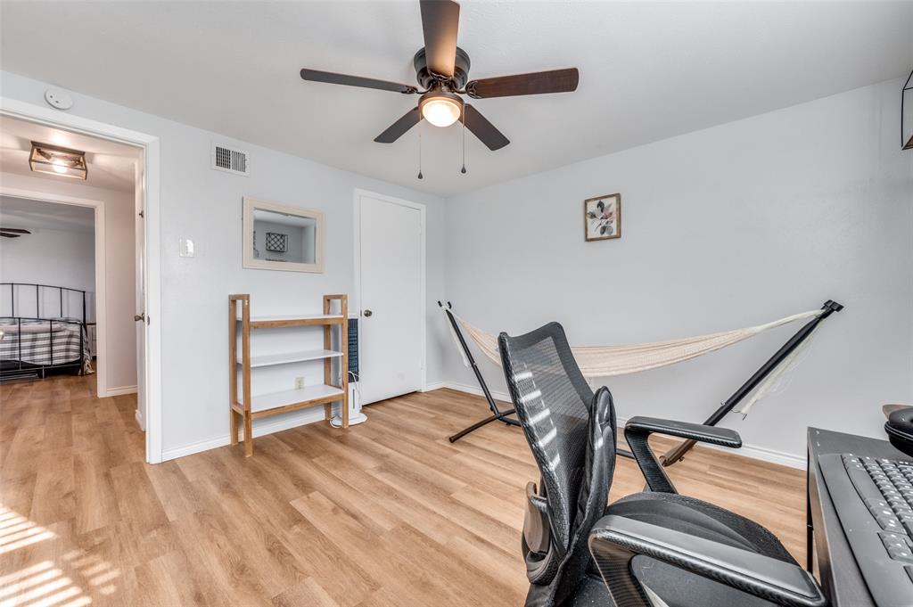 2924 West 11th Street Irving, TX 75060 - Photo 26 of 39 a workspace with a table and a chair