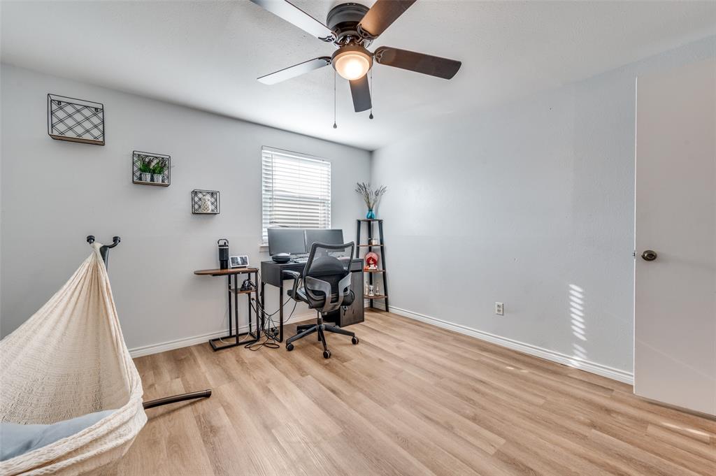 2924 West 11th Street Irving, TX 75060 - Photo 27 of 39 a view of a workspace with furniture and a window
