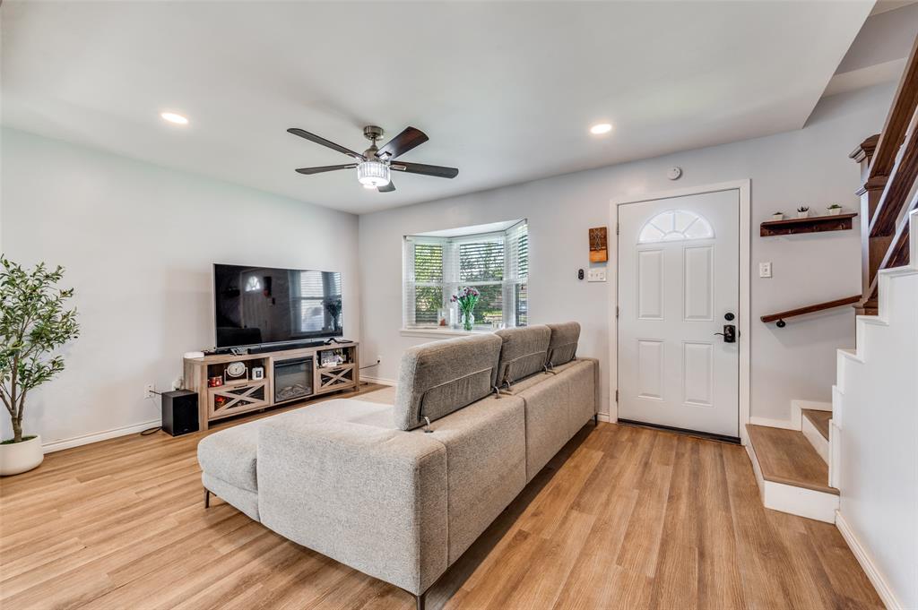 2924 West 11th Street Irving, TX 75060 - Photo 7 of 39 a living room with furniture and a flat screen tv