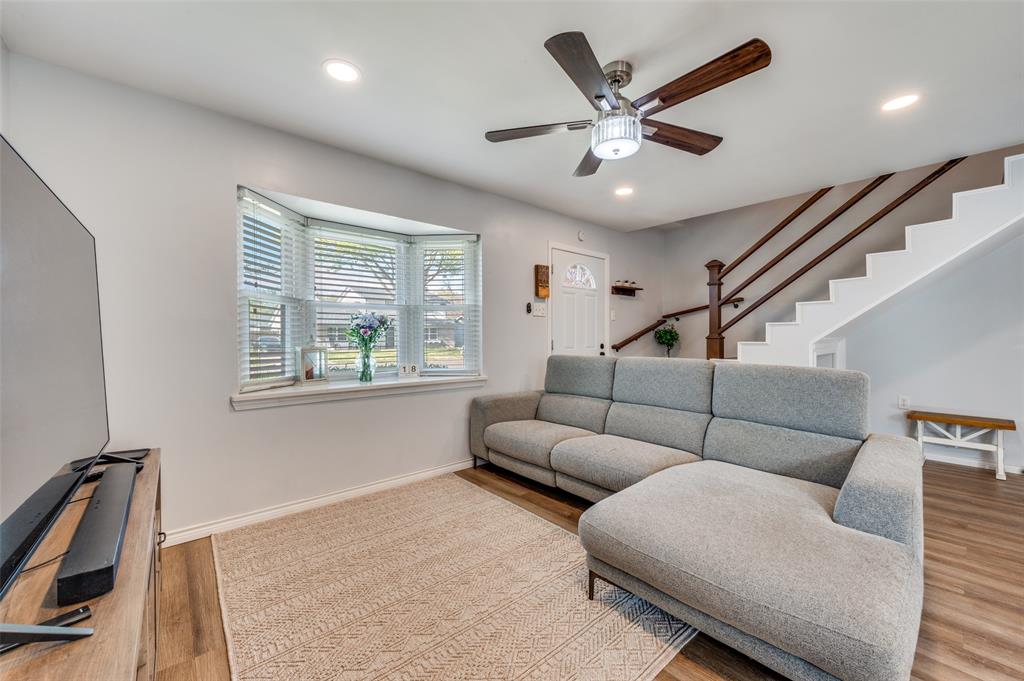 2924 West 11th Street Irving, TX 75060 - Photo 8 of 39 a living room with furniture and a ceiling fan