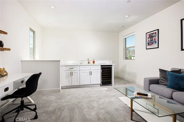 a view of workspace with furniture and window