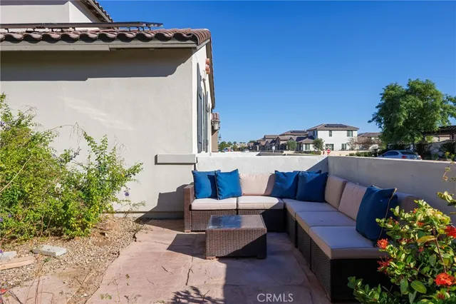 a view of a backyard with sitting area and furniture