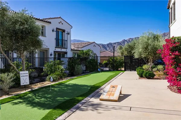 an aerial view of a house a yard and a patio