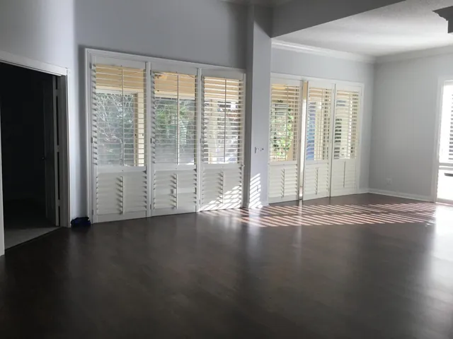 a view of a room with wooden floor and walls
