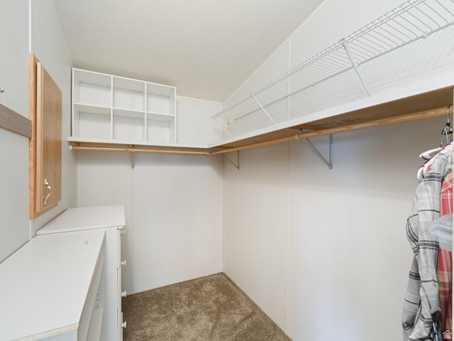 3941 West 40 North Hurricane, UT 84737 - Photo 23 of 55 Walk-in closet featuring built-in shelving, hanging rods, and an integrated dresser with drawers