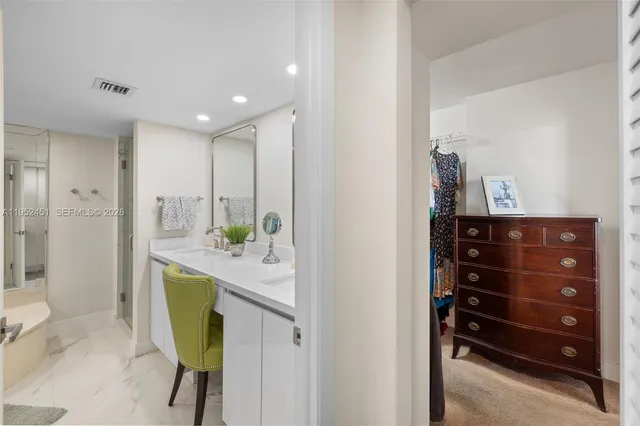 a kitchen with a refrigerator and a sink