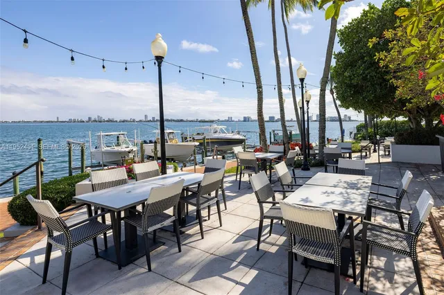 a view of an outside dining space with furniture