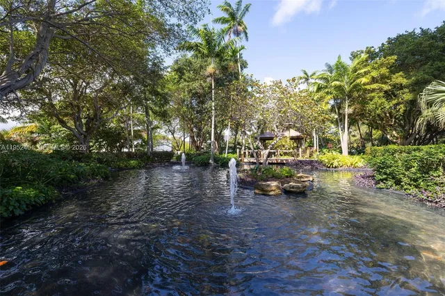 a view of a park with large trees