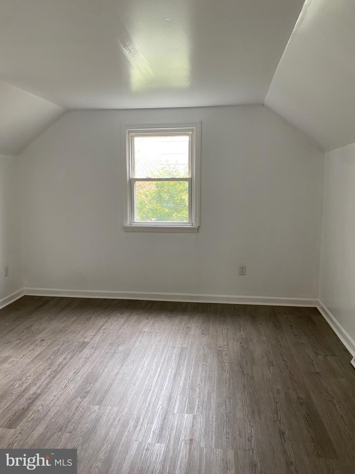 4 Riviera Drive Pennsville, NJ 08070 - Photo 16 of 22 an empty room with wooden floor and windows