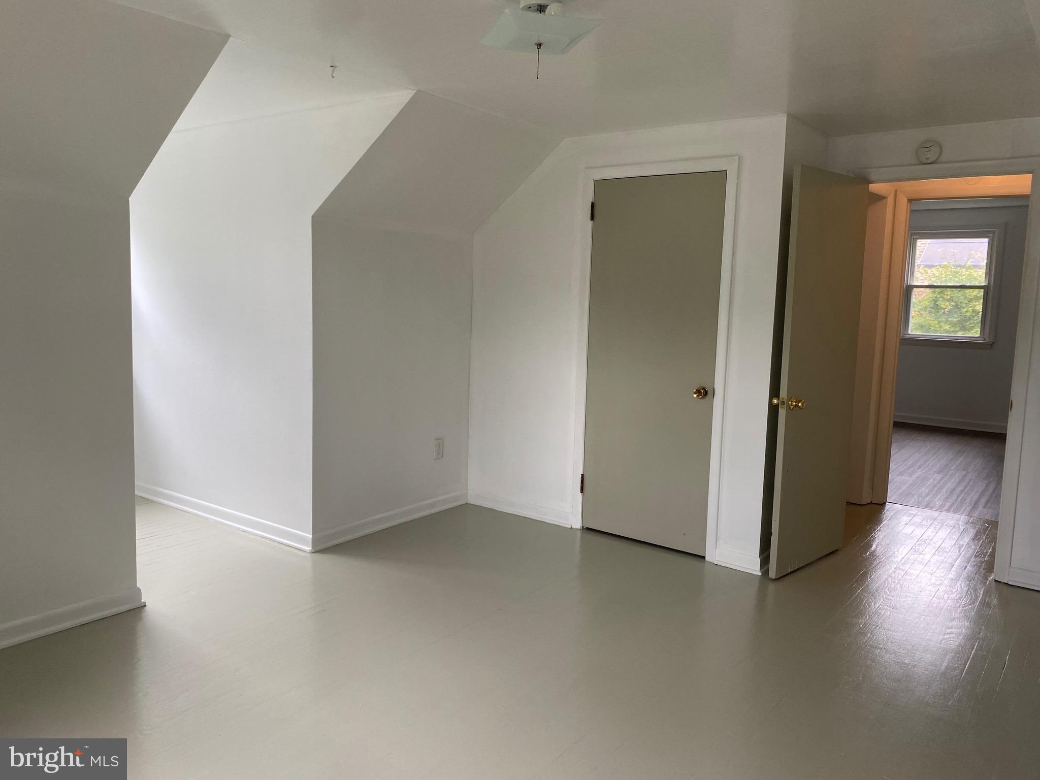 4 Riviera Drive Pennsville, NJ 08070 - Photo 20 of 22 an empty room with wooden floor and windows