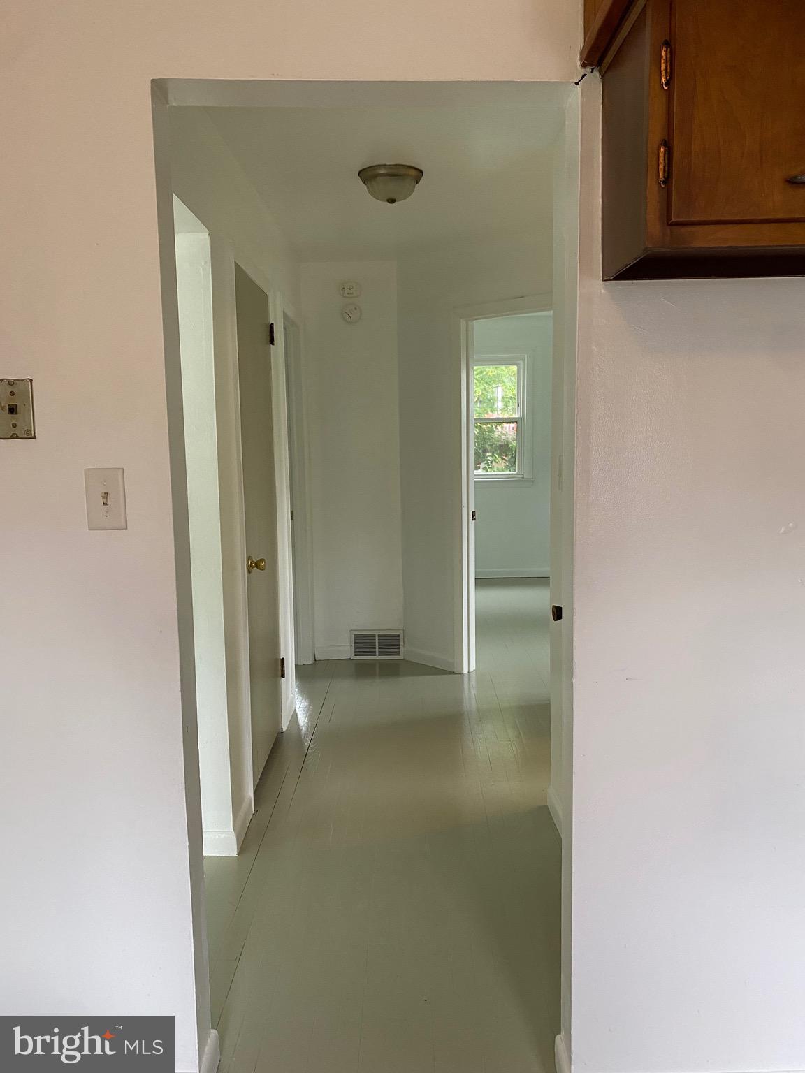 4 Riviera Drive Pennsville, NJ 08070 - Photo 7 of 22 a view of a hallway with wooden shelves