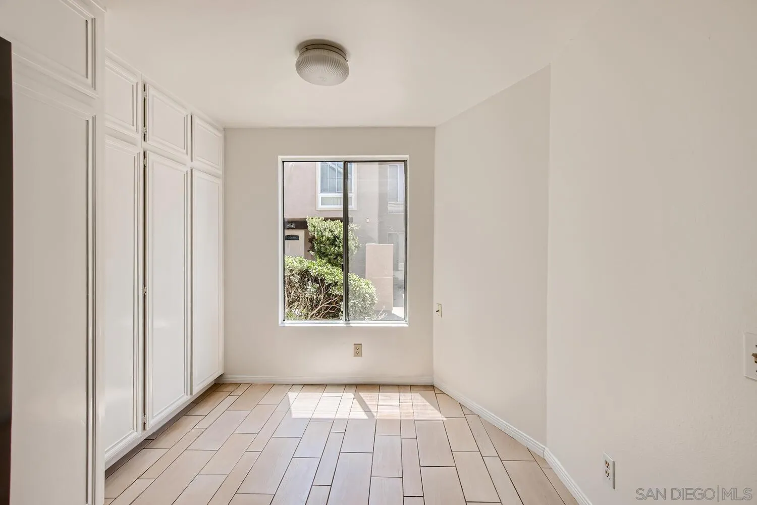 23949 Green Haven Lane Ramona, CA 92065 - Photo 13 of 28 a view of a hallway with wooden floor and a window
