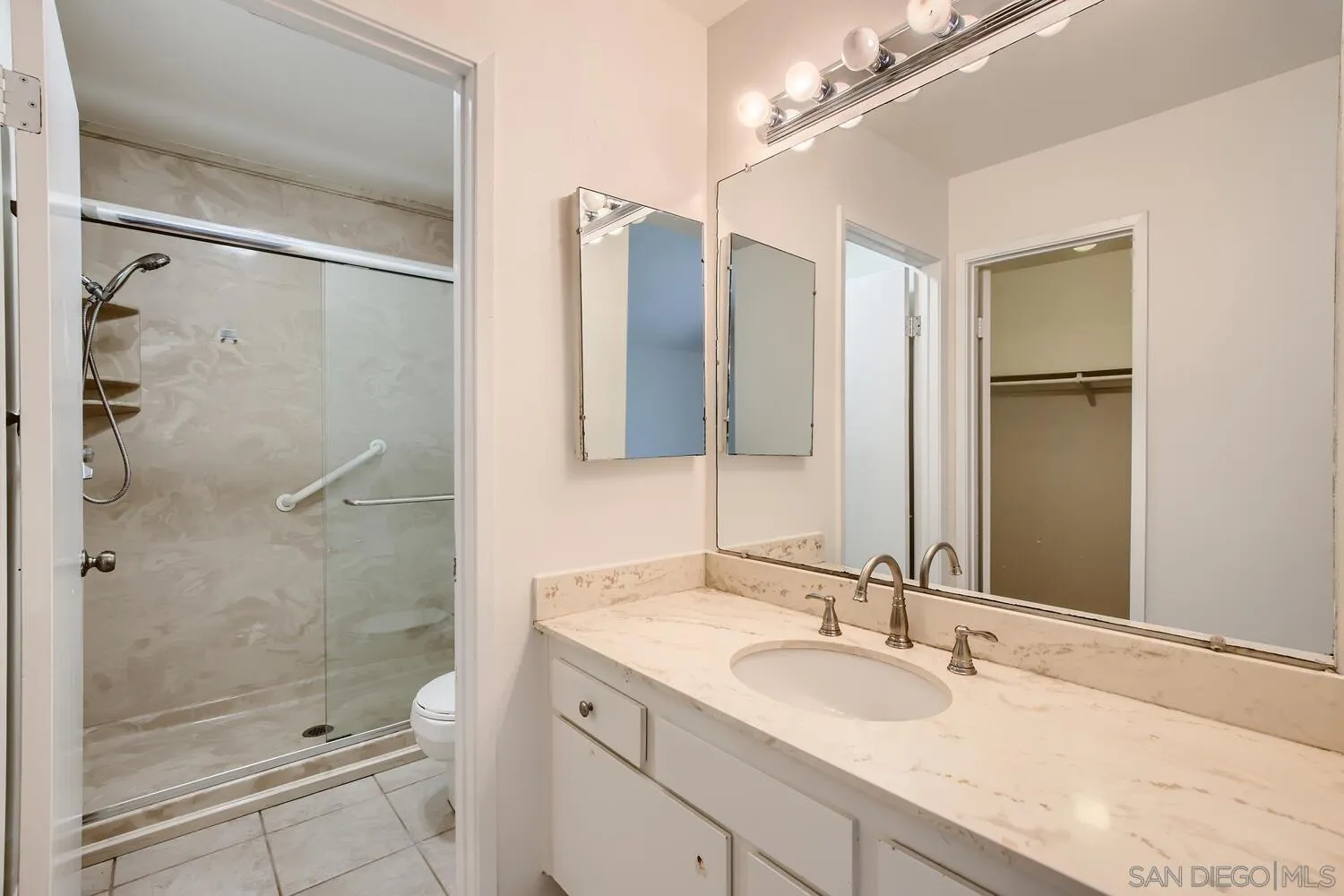 23949 Green Haven Lane Ramona, CA 92065 - Photo 16 of 28 a bathroom with a granite countertop sink mirror and shower