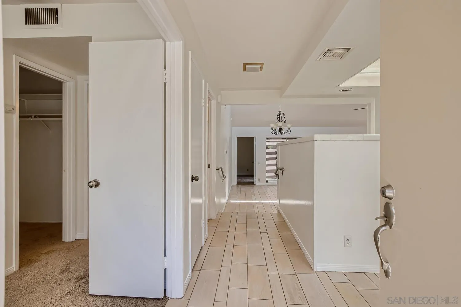 23949 Green Haven Lane Ramona, CA 92065 - Photo 4 of 28 a view of a hallway with wooden floor and entryway