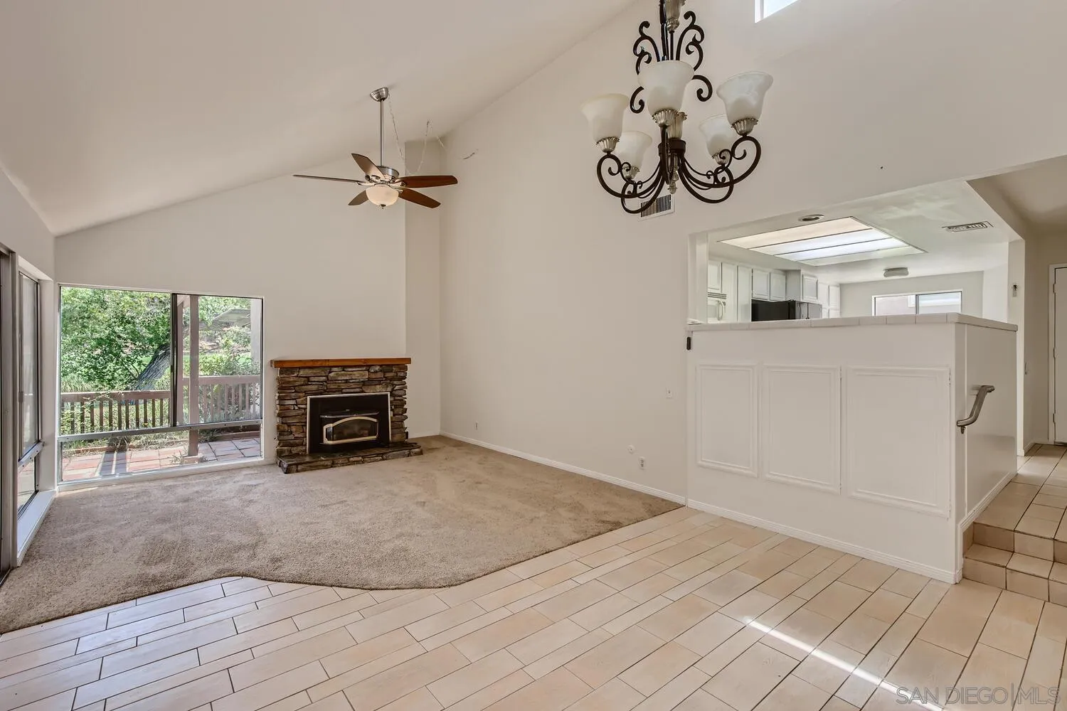 23949 Green Haven Lane Ramona, CA 92065 - Photo 6 of 28 a view of a livingroom with a fireplace a chandelier and wooden floor
