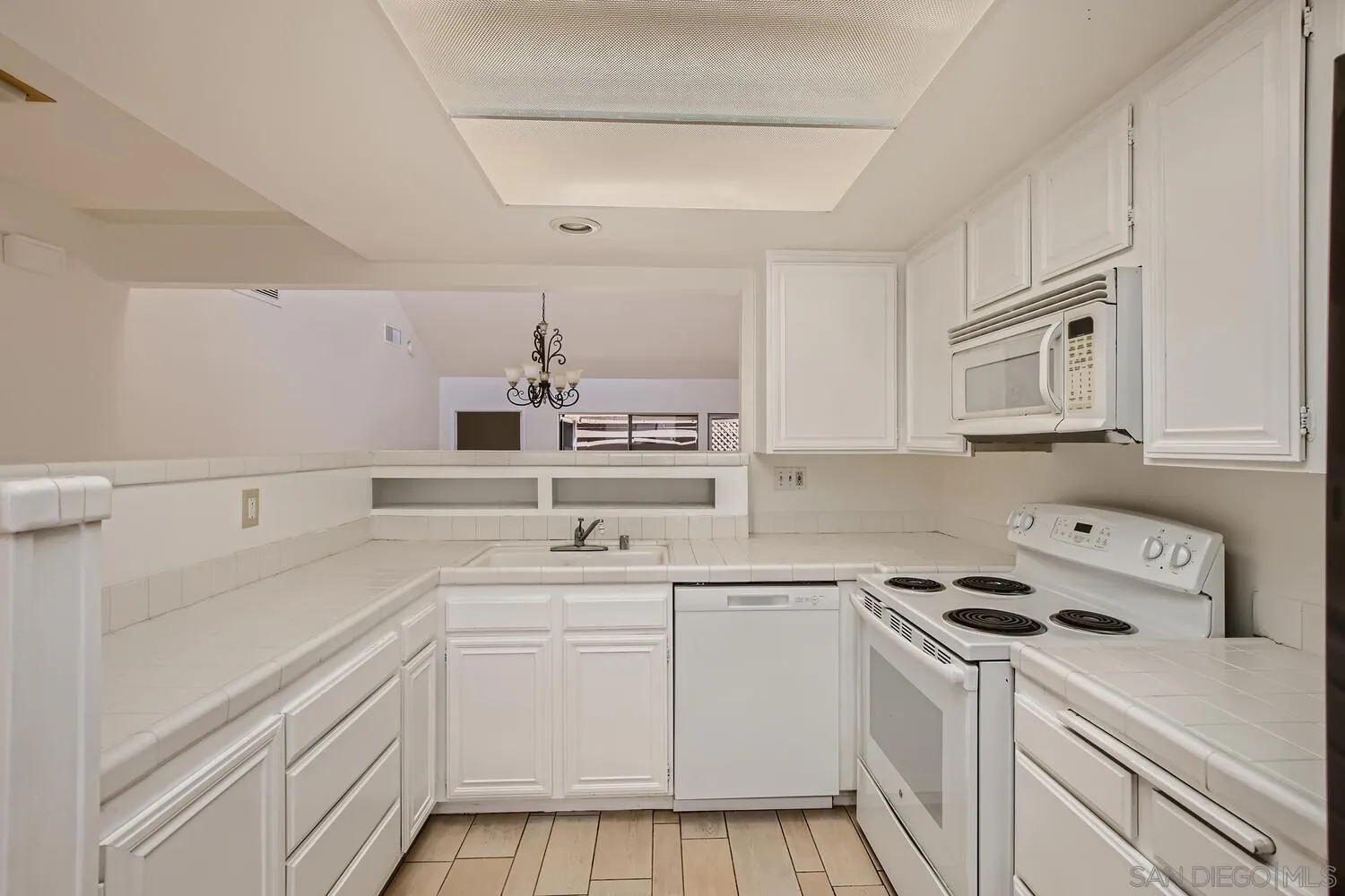 23949 Green Haven Lane Ramona, CA 92065 - Photo 9 of 28 a kitchen with cabinets appliances a sink and a counter top space