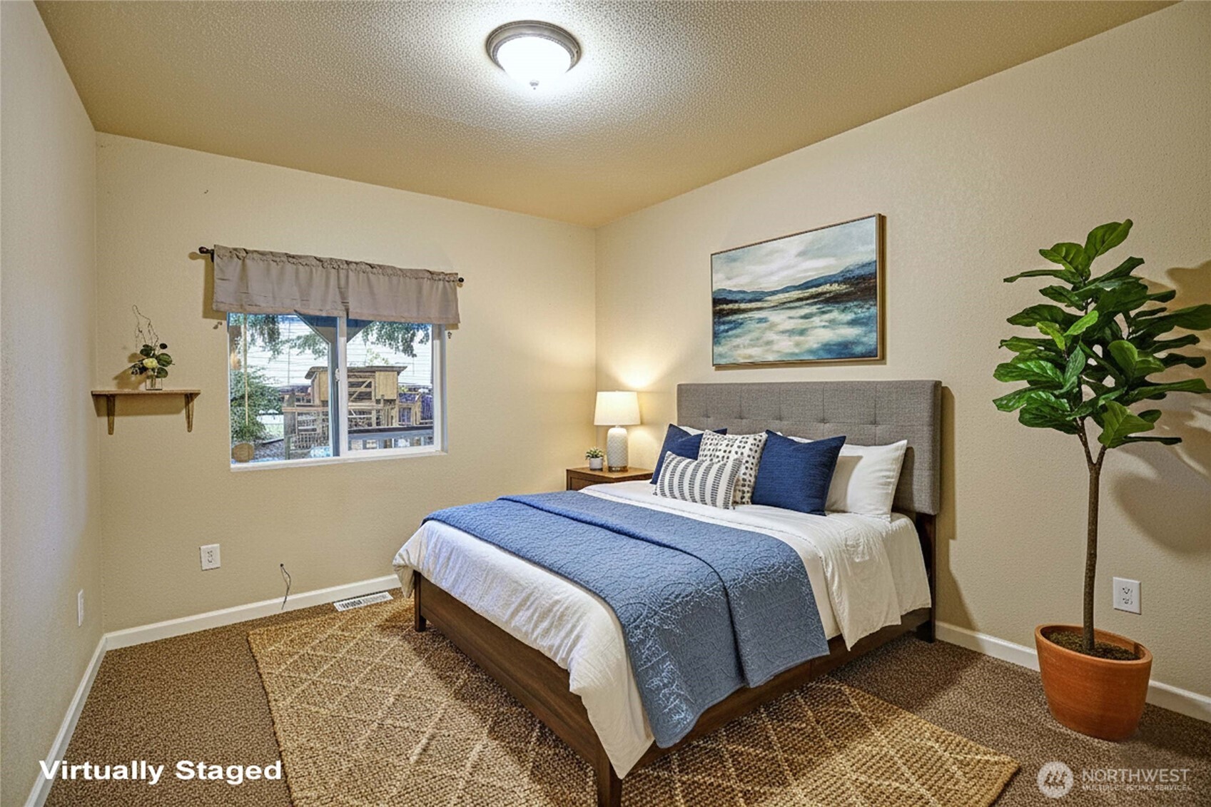 208 West Galena Street Granite Falls, WA 98252 - Photo 19 of 40 a bedroom with a bed and a potted plant