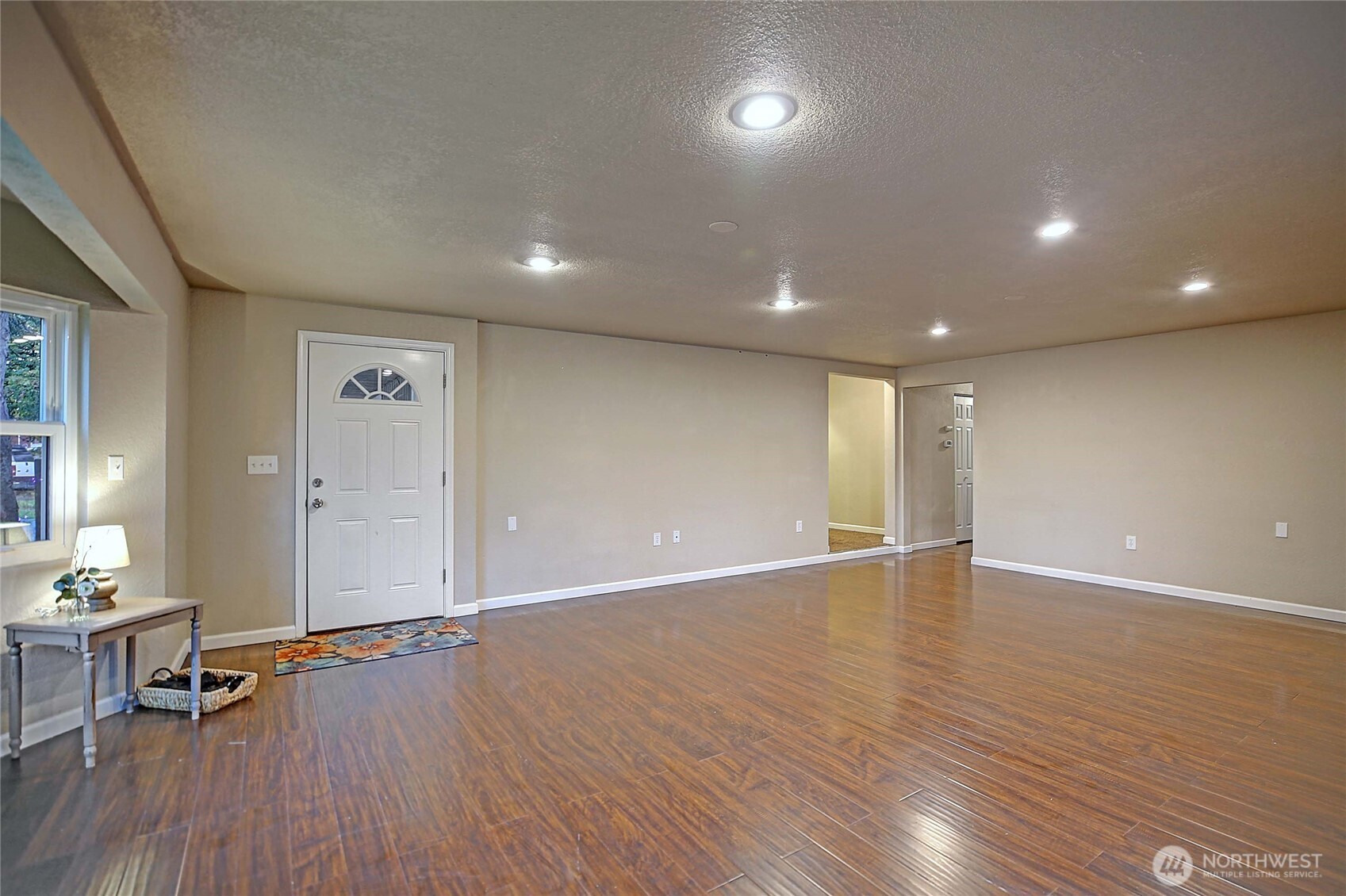 208 West Galena Street Granite Falls, WA 98252 - Photo 5 of 40 an empty room with wooden floor and windows